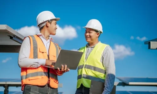 young-asian-technician-man-colleague-safety-uniform-checking-operation-sun-photovoltaic-solar-panel-use-laptop-computer-while-working-solar-farm_1150-57234 young-asian-technician-man-colleague-safety-uniform-checking-operation-sun-photovoltaic-solar-panel-use-laptop-computer-while-working-solar-farm_1150-57234